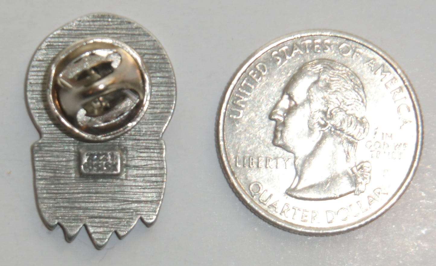 Shield with Feathers Collector's Lapel Pin